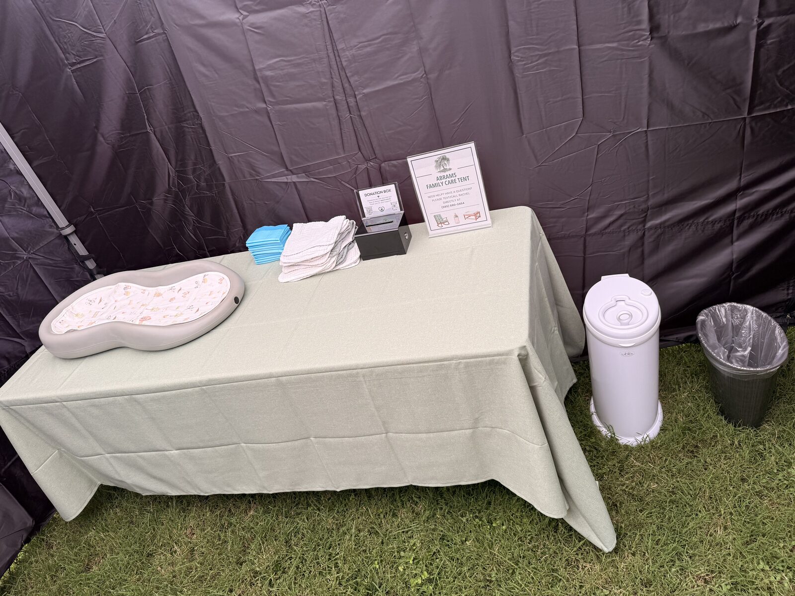Changing station with pads, burp cloths, and diaper pail