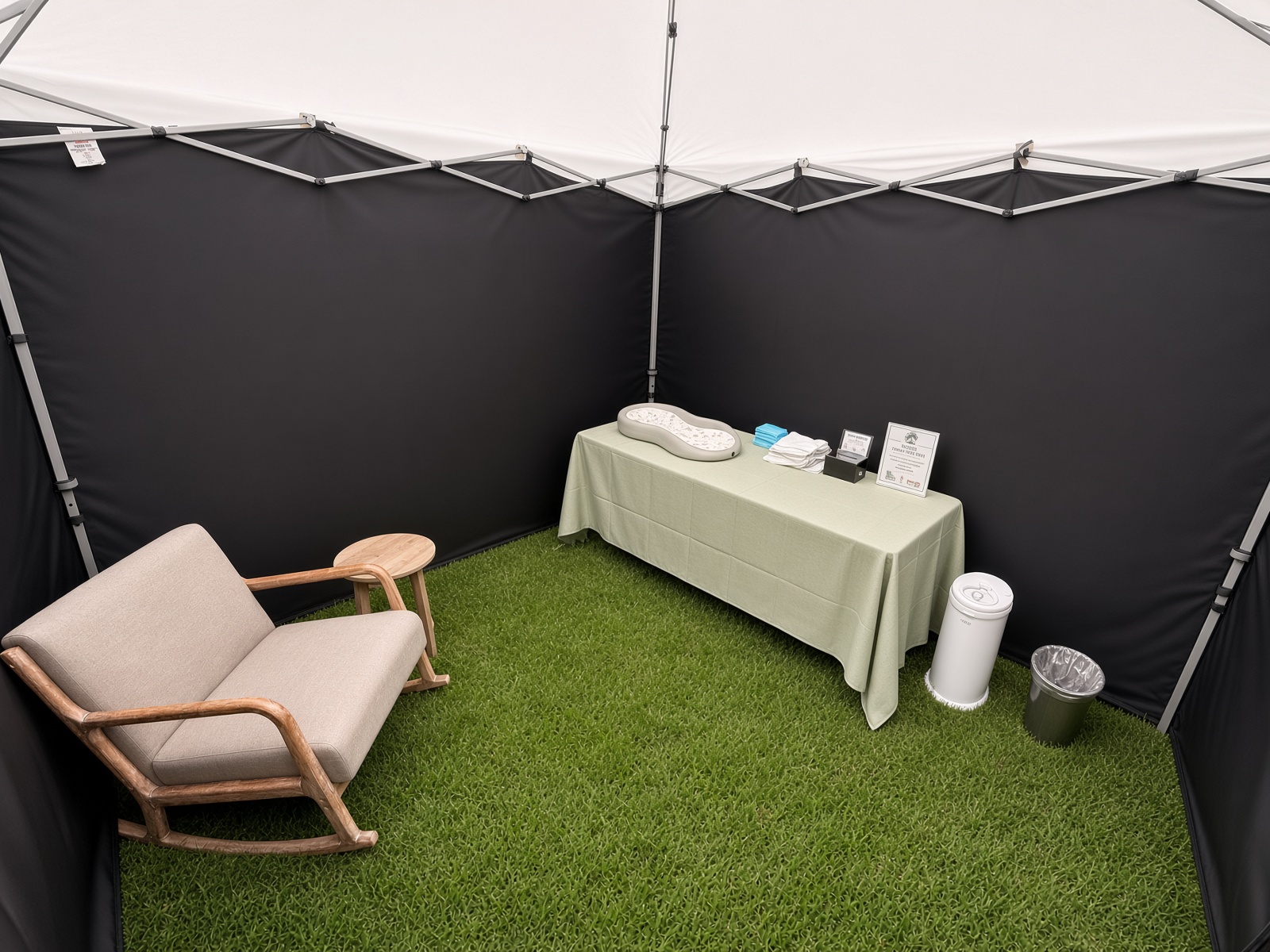 Inside the tent: rocking chair, end table, and changing station