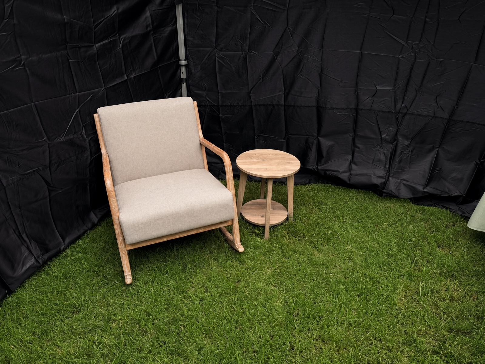 Rocking chair and round end table inside the tent